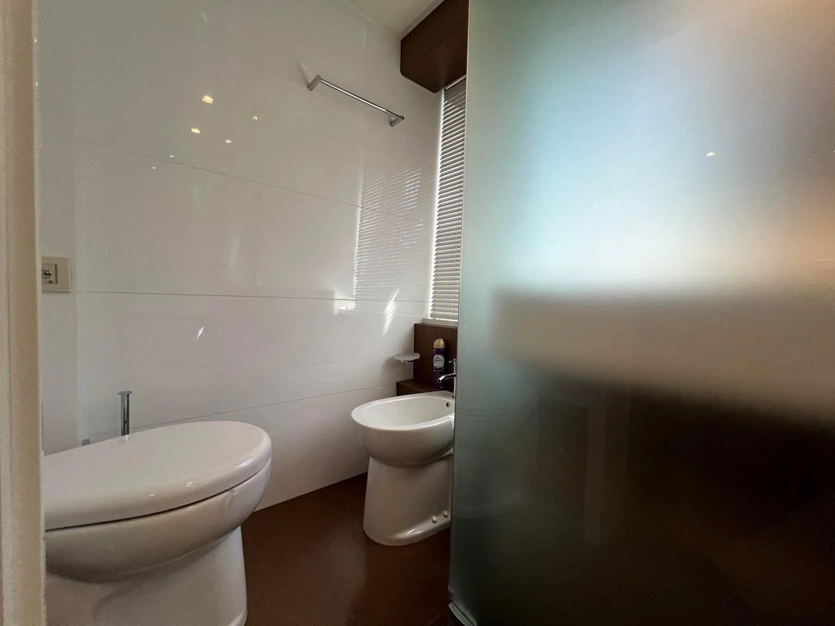 a bathroom with a toilet and a sink aboard NGV Yacht for Sale