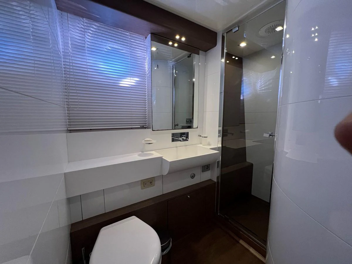 a bathroom with a toilet and a sink aboard NGV Yacht for Sale