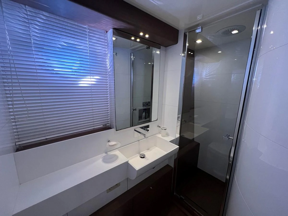 a bathroom with a tub sink and sinks aboard NGV Yacht for Sale
