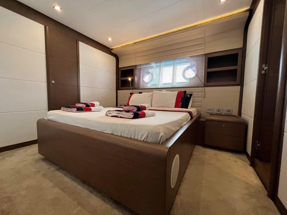 a bedroom with a bed aboard NGV Yacht for Sale