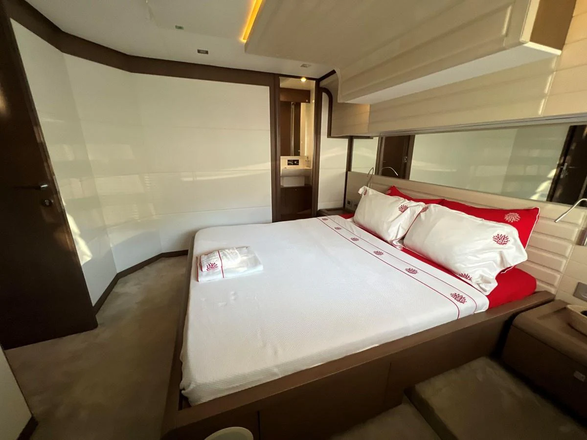 a bed in a room aboard NGV Yacht for Sale
