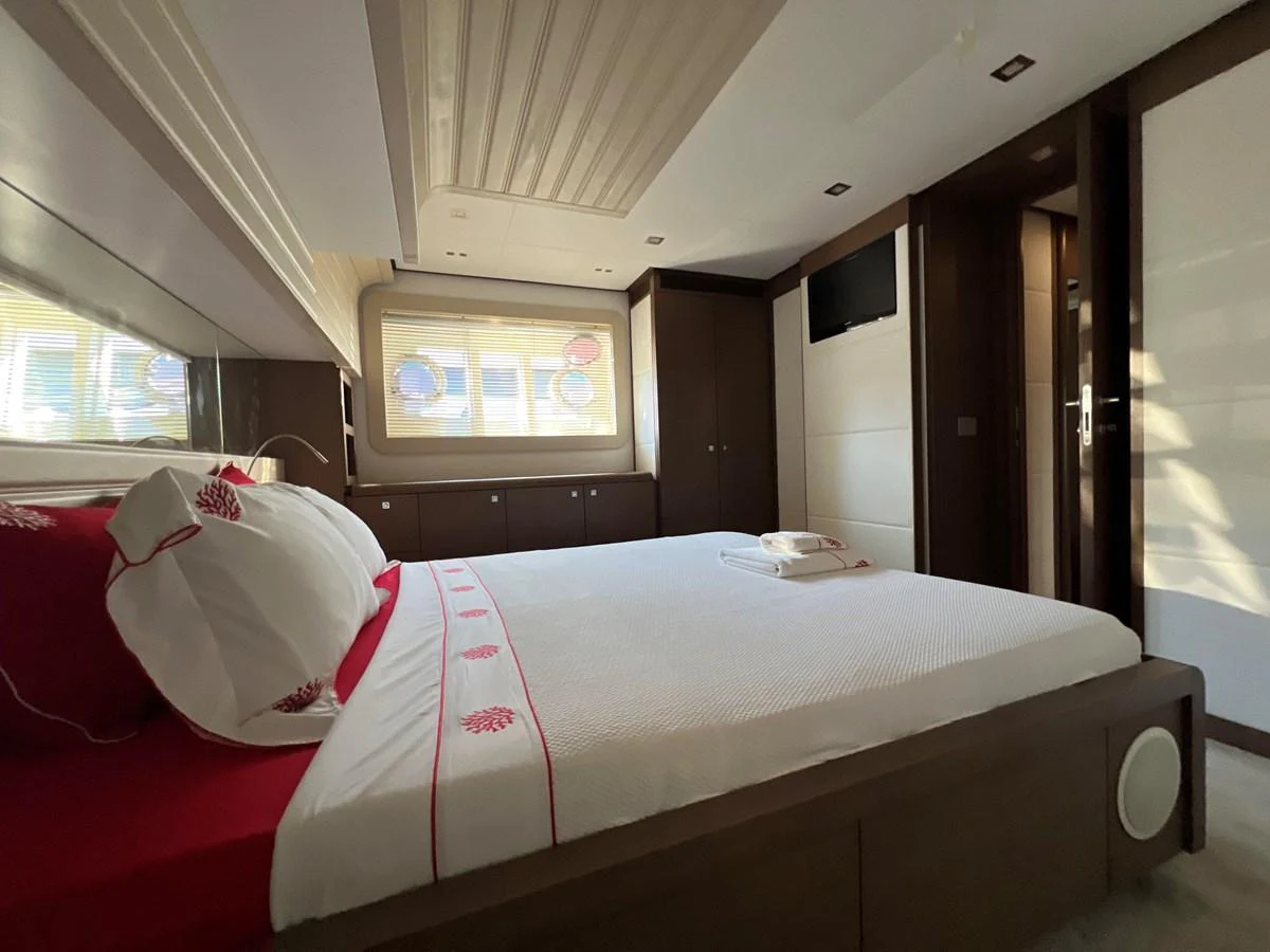 a bed in a room aboard NGV Yacht for Sale