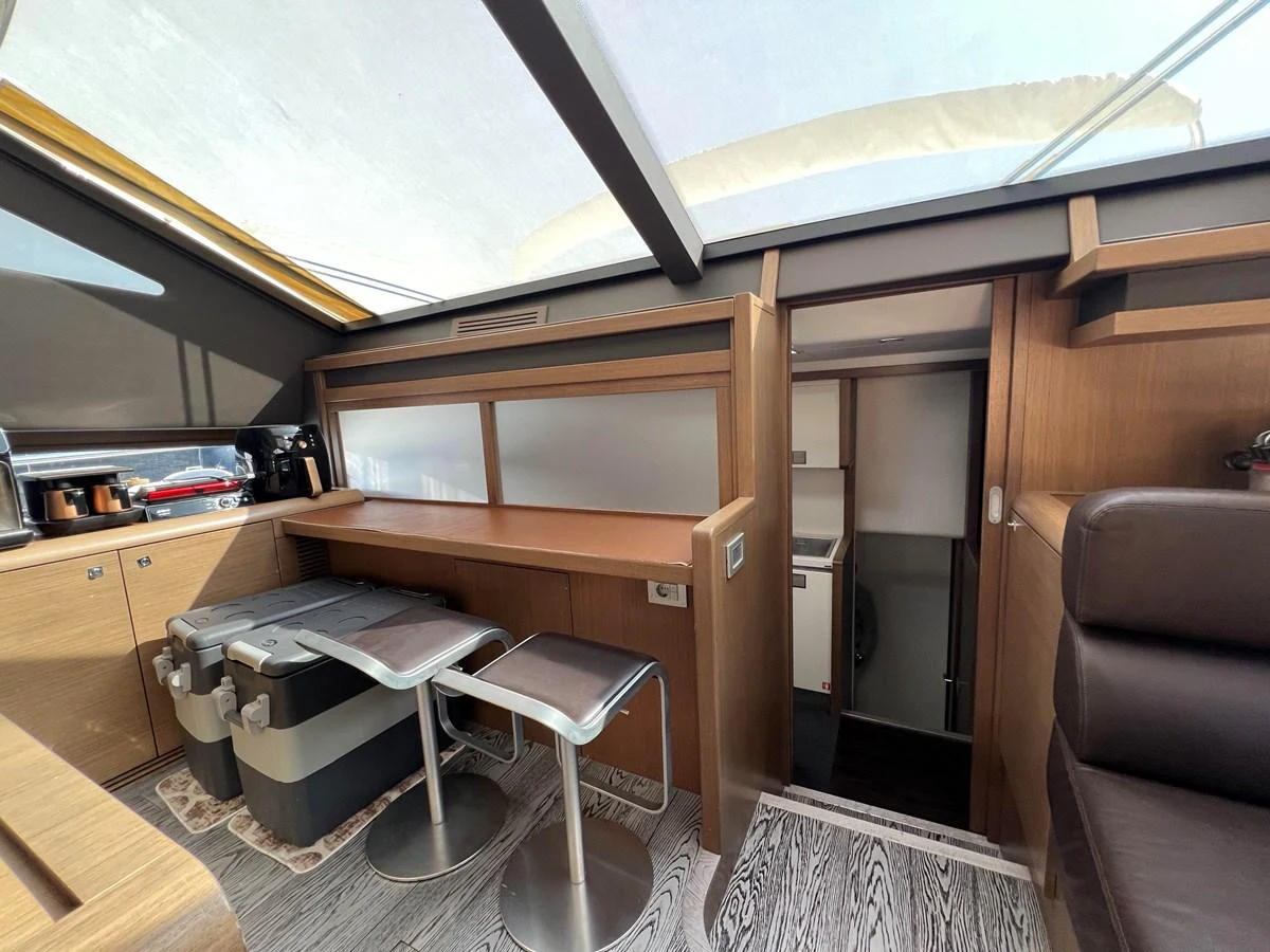 a room with a desk and a chair aboard NGV Yacht for Sale