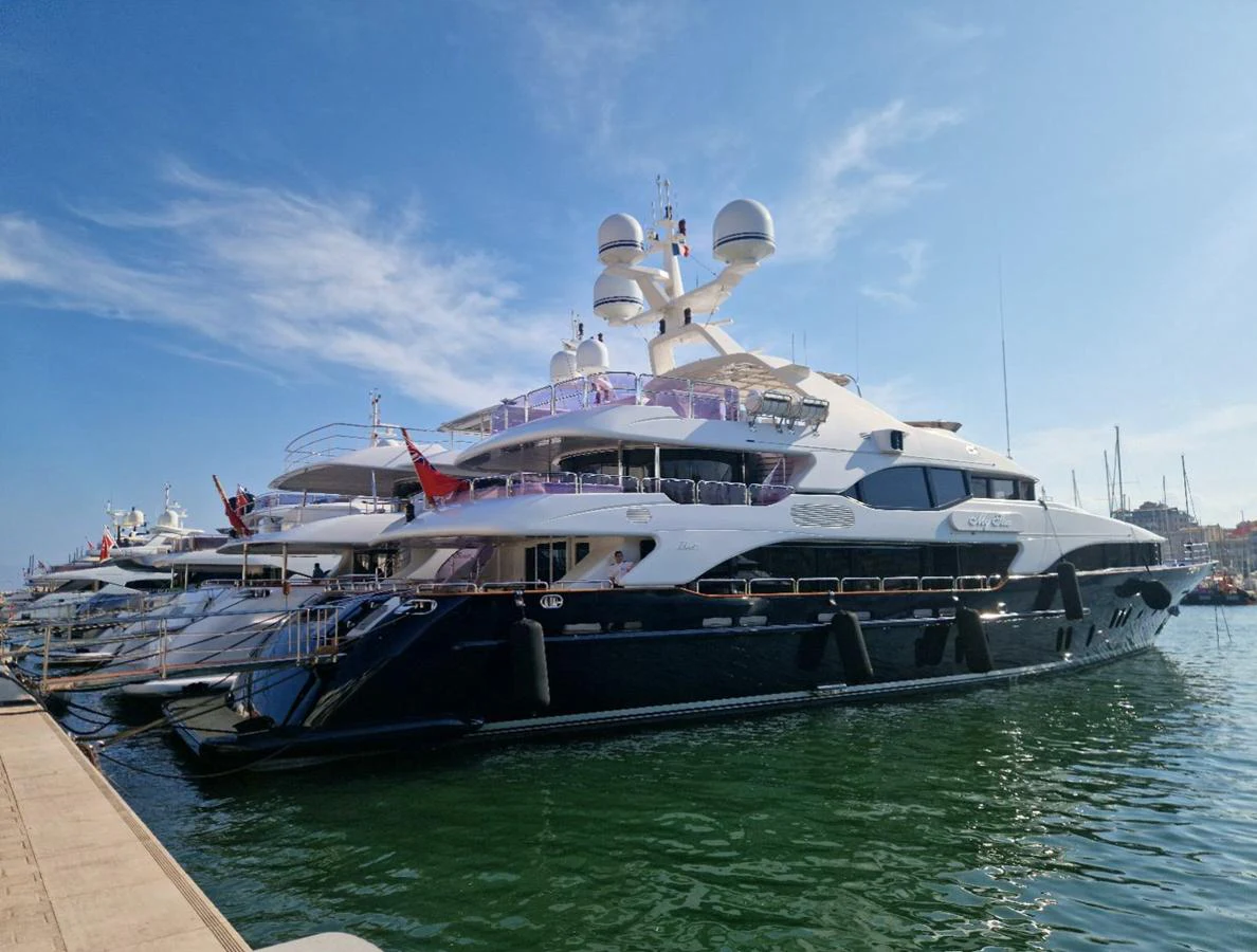 A luxurious yacht is docked at the marina, showcasing its sleek design and modern amenities. aboard MY SISA Yacht for Sale