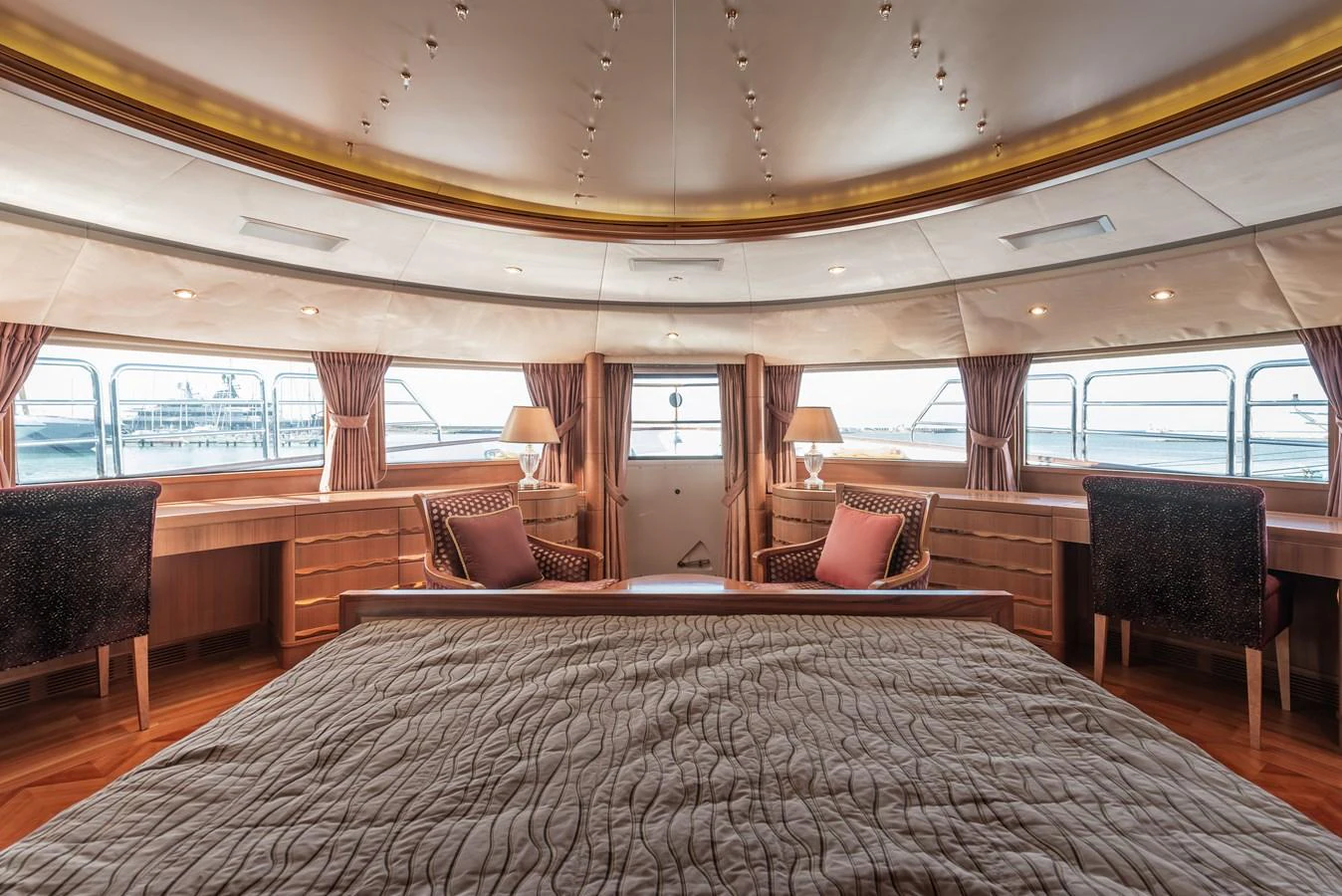 The master stateroom offers a spacious and luxurious retreat with panoramic windows and elegant furnishings. aboard MY SISA Yacht for Sale