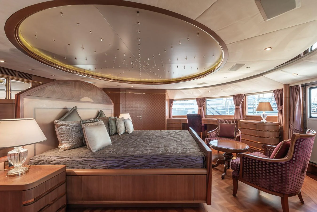 The master stateroom exudes luxury with its spacious layout, elegant furnishings, and ambient lighting. aboard MY SISA Yacht for Sale