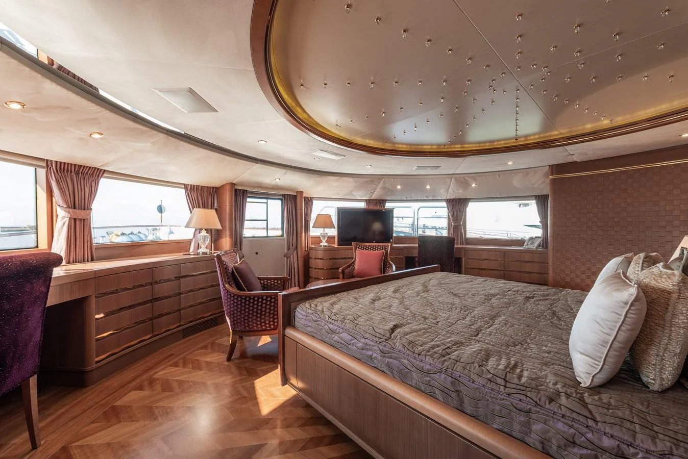 The master stateroom features luxurious furnishings and expansive windows for a serene retreat. aboard MY SISA Yacht for Sale