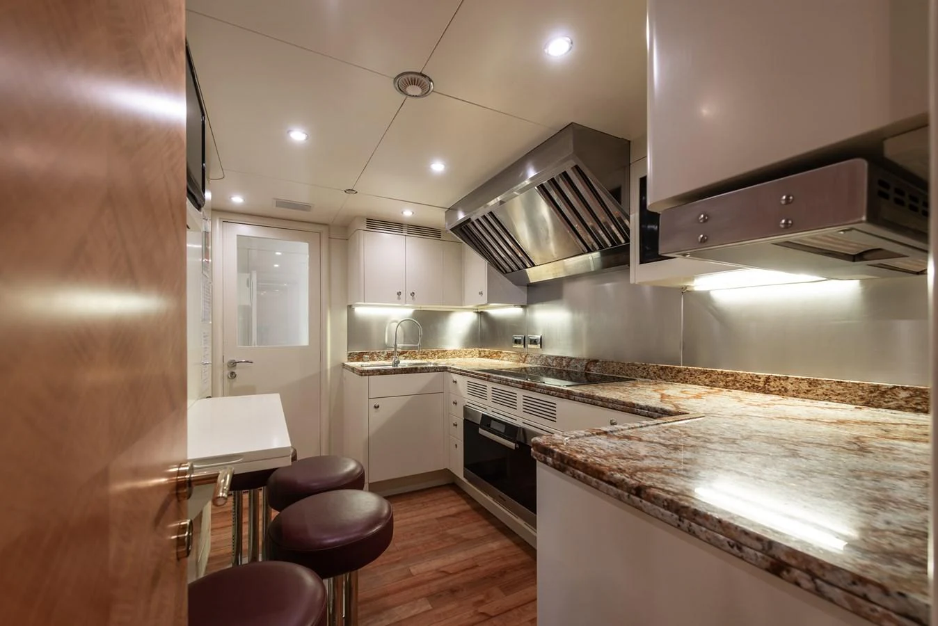 The yacht's galley features modern appliances and a sleek design with ample counter space. aboard MY SISA Yacht for Sale