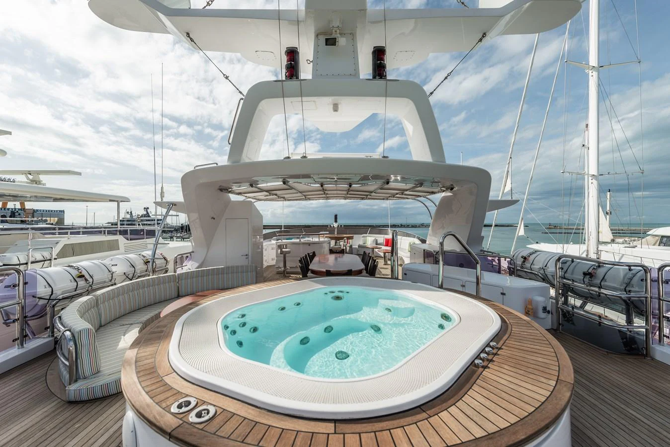 The sundeck features a luxurious jacuzzi surrounded by ample seating and stunning views. aboard MY SISA Yacht for Sale