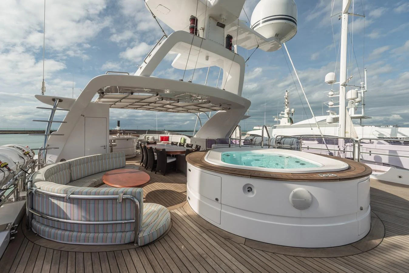 The sundeck features a luxurious hot tub and ample seating for relaxation. aboard MY SISA Yacht for Sale