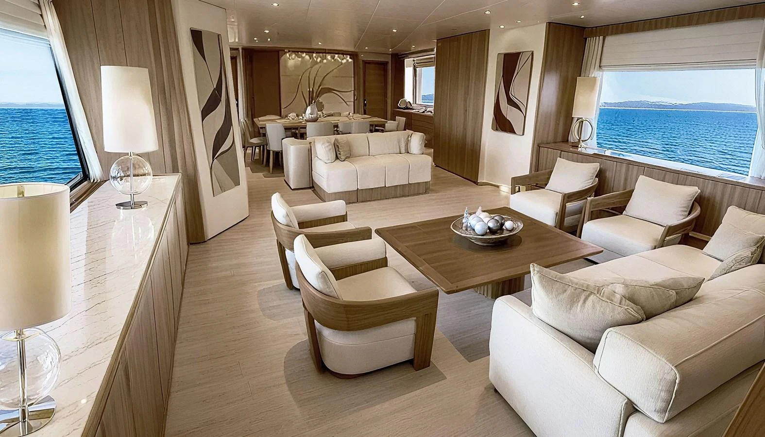 a living room with a couch and a table aboard DEIMOS Yacht for Sale
