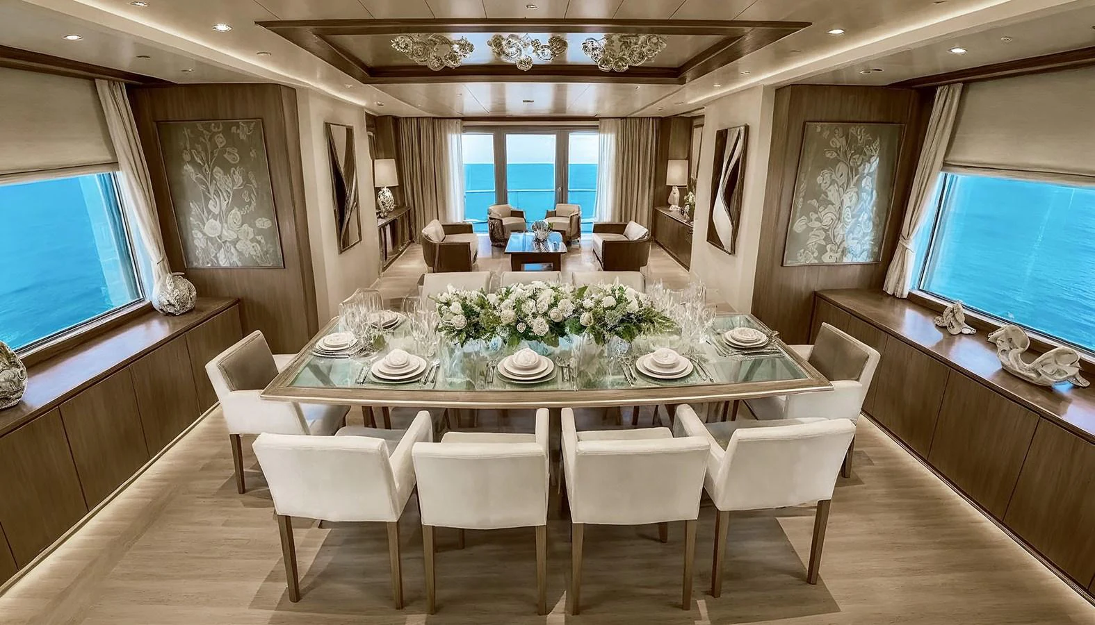 a room with a table chairs and a large window aboard DEIMOS Yacht for Sale