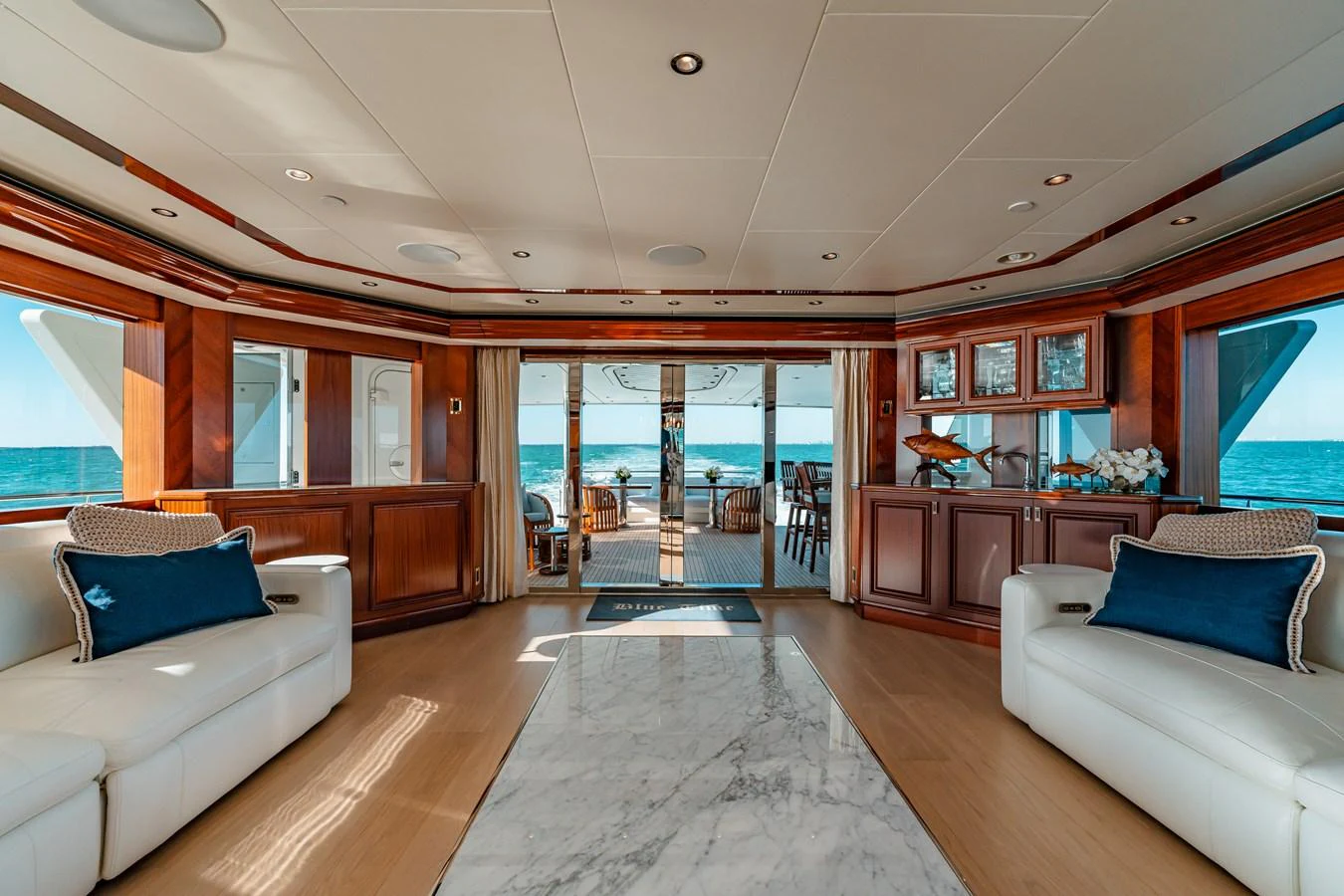 a living room with a large glass door aboard BLUE TIME Yacht for Sale