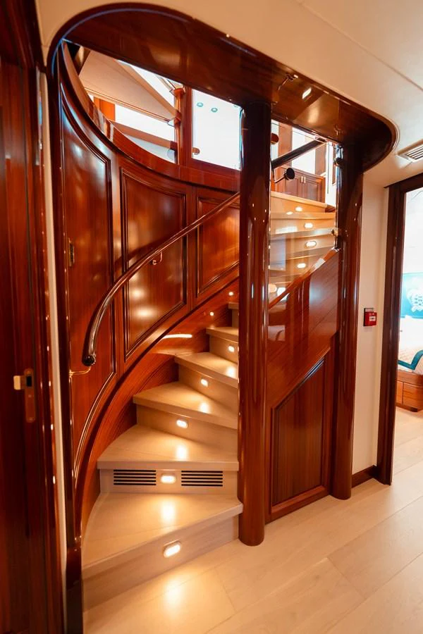 a wooden door with a glass window aboard BLUE TIME Yacht for Sale