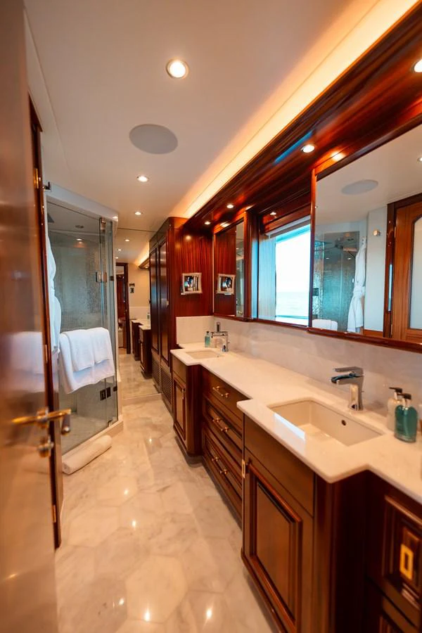 a bathroom with a sink and a mirror aboard BLUE TIME Yacht for Sale