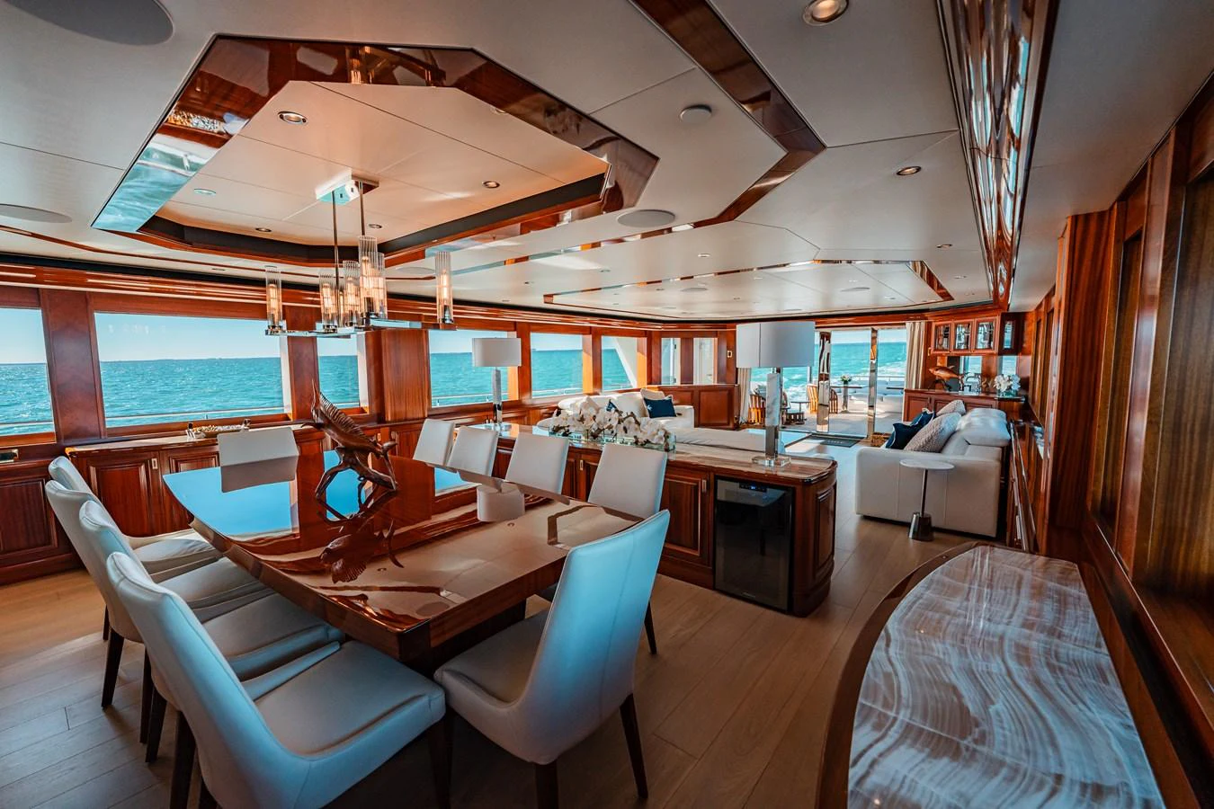 a large room with a table and chairs aboard BLUE TIME Yacht for Sale