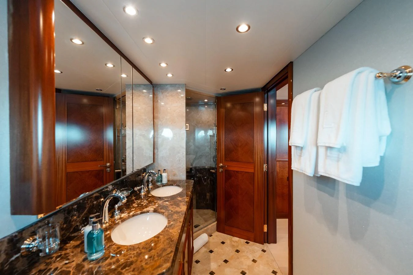 a bathroom with a countertop sink and a mirror aboard BLUE TIME Yacht for Sale
