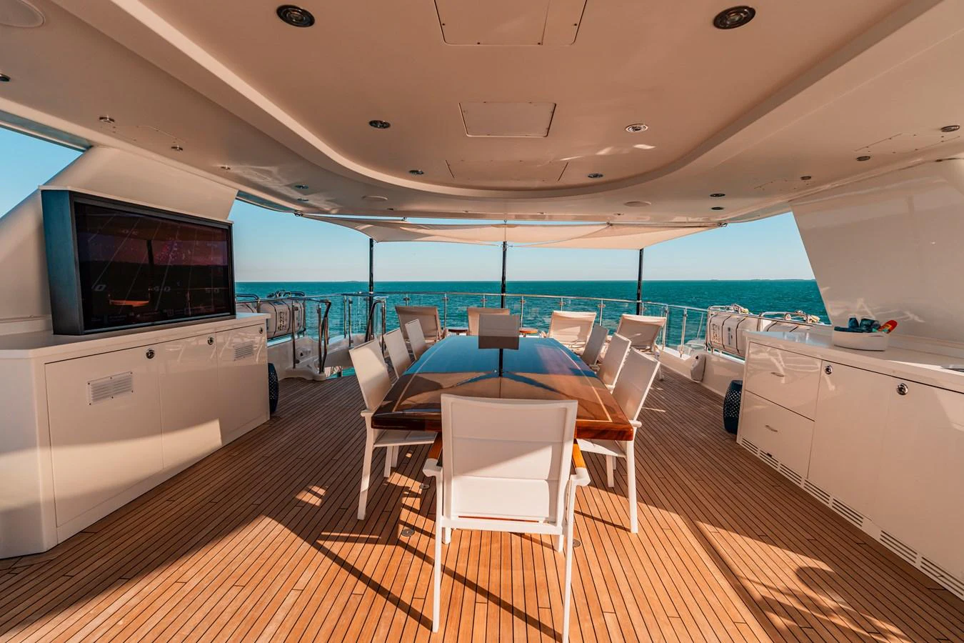a room with a table and chairs aboard BLUE TIME Yacht for Sale