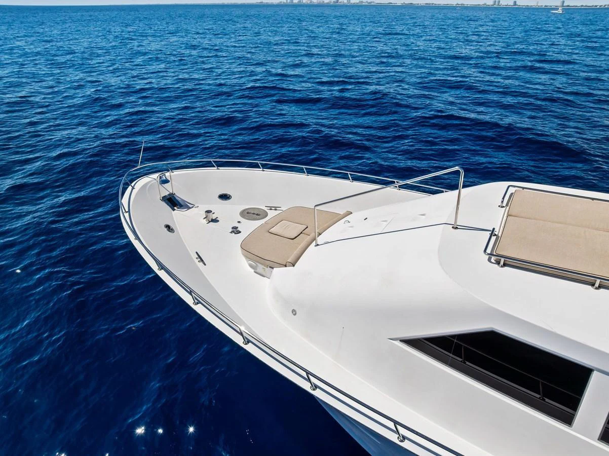 The sleek foredeck of the yacht features sun pads and a clean, modern design, perfect for relaxation. aboard BRAVO ZULU Yacht for Sale