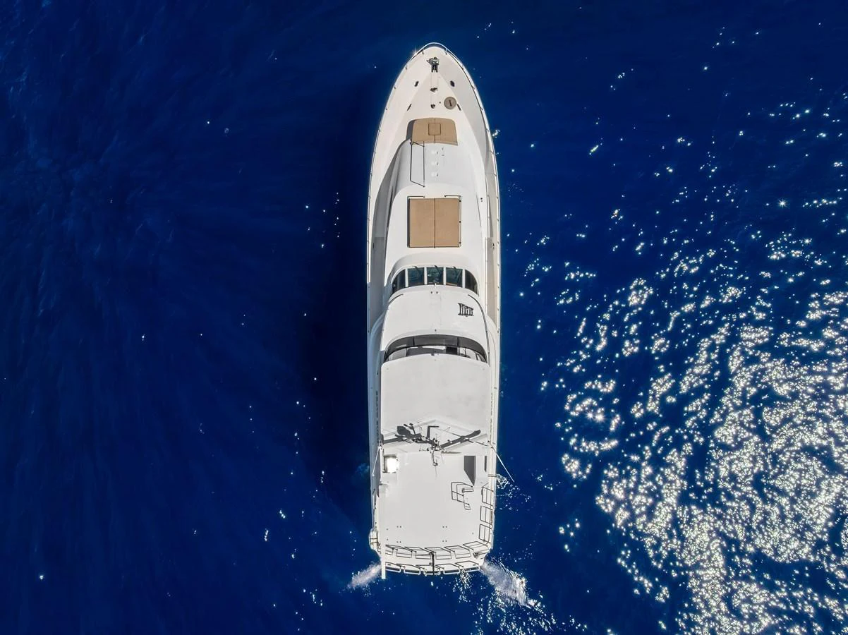 Aerial view of a luxurious yacht cruising through deep blue waters. aboard BRAVO ZULU Yacht for Sale