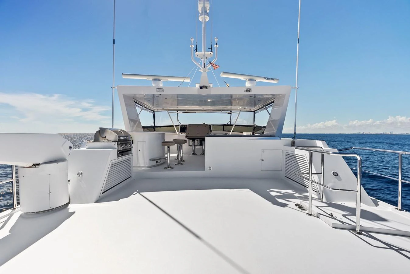 The flybridge offers a spacious and open area with stunning ocean views. aboard BRAVO ZULU Yacht for Sale
