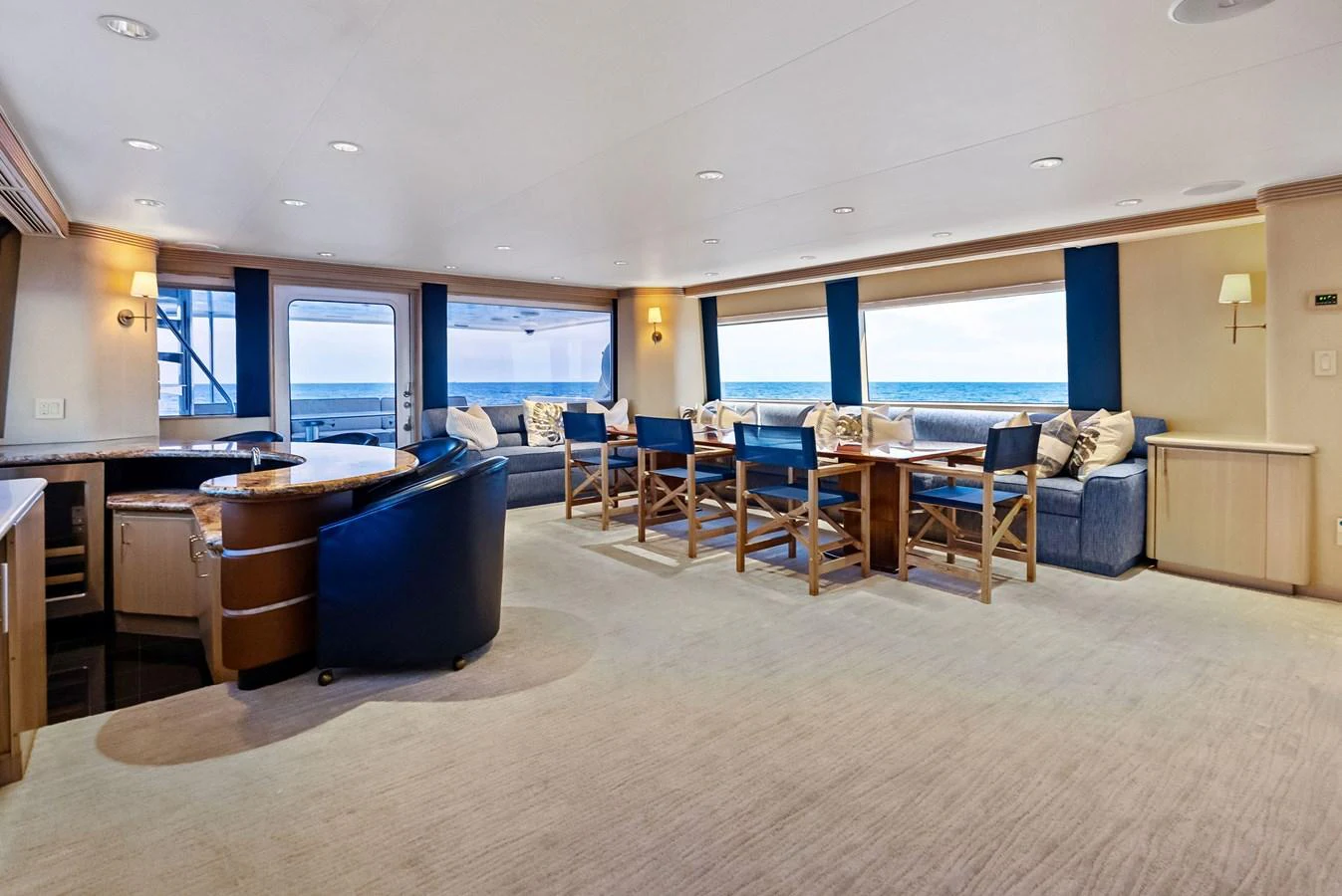 The spacious salon features comfortable seating with panoramic ocean views. aboard BRAVO ZULU Yacht for Sale
