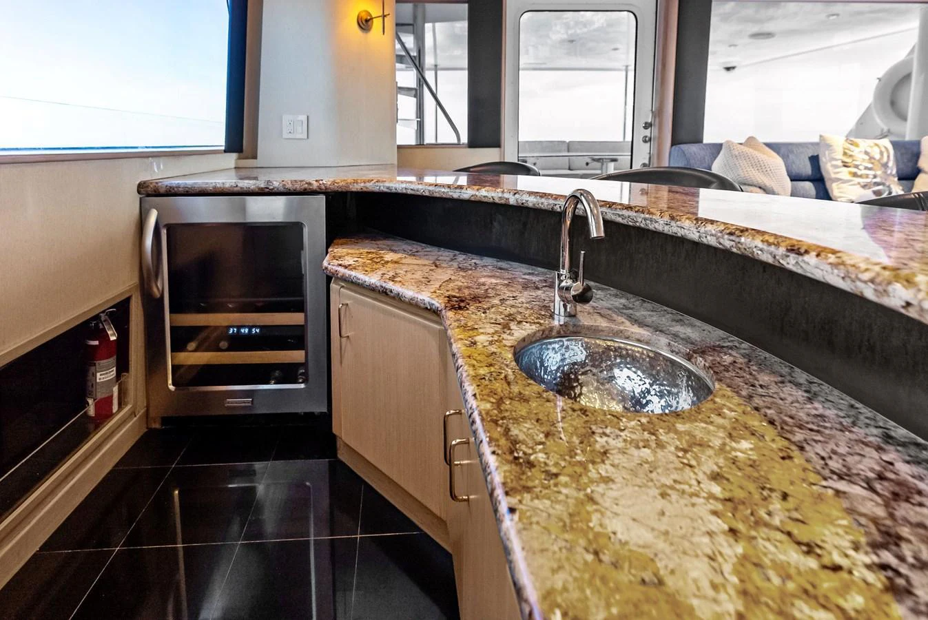 The yacht's galley features a sleek countertop with a built-in sink and modern appliances. aboard BRAVO ZULU Yacht for Sale