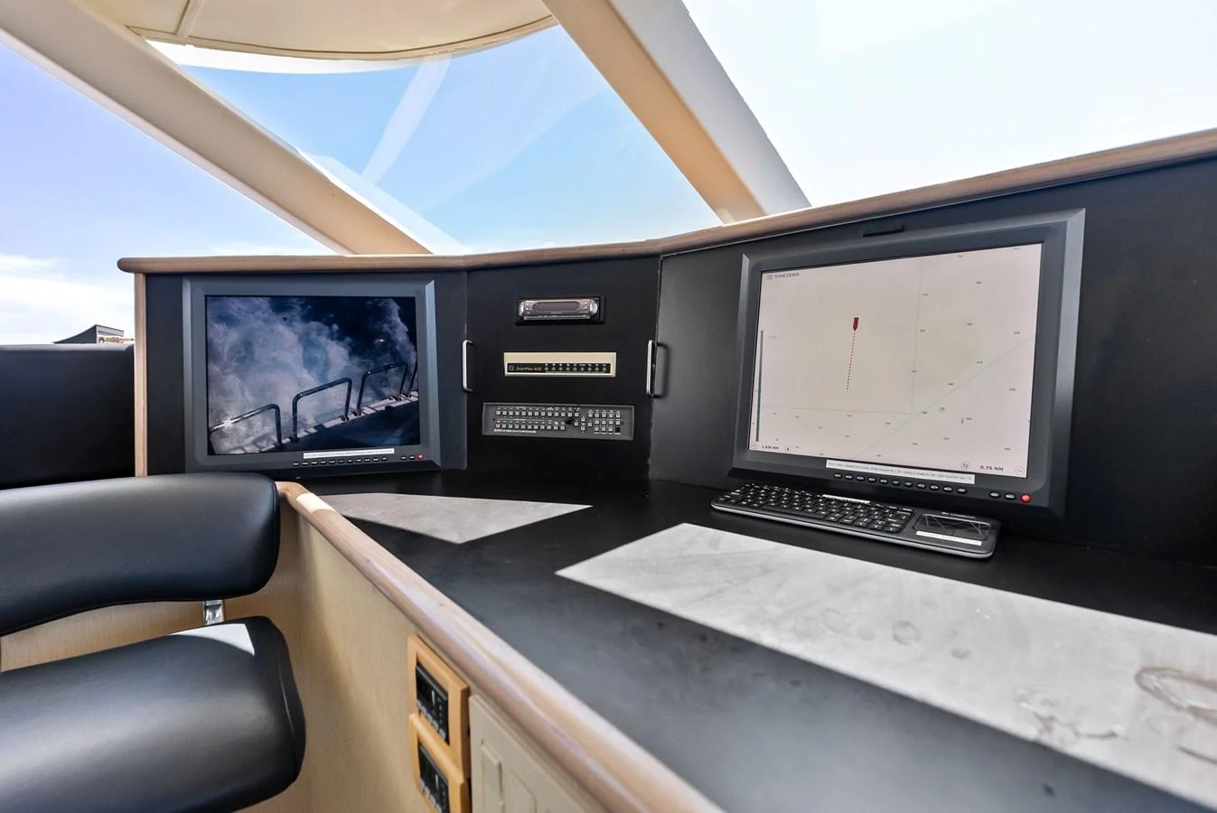 The helm station features advanced navigation equipment and comfortable seating. aboard BRAVO ZULU Yacht for Sale