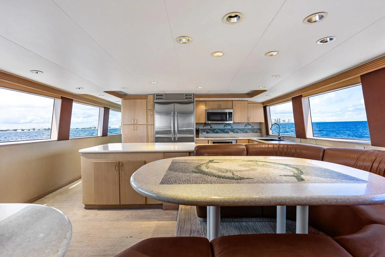 The yacht's galley features modern appliances, ample counter space, and large windows offering stunning ocean views. aboard BRAVO ZULU Yacht for Sale