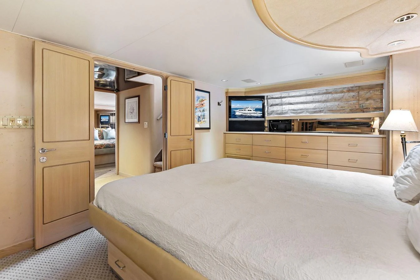 The master stateroom features a spacious bed, ample storage, and a cozy ambiance. aboard BRAVO ZULU Yacht for Sale
