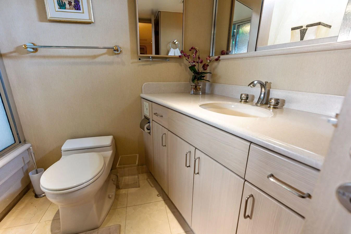 The yacht's bathroom features a sleek design with modern fixtures and ample storage space. aboard BRAVO ZULU Yacht for Sale