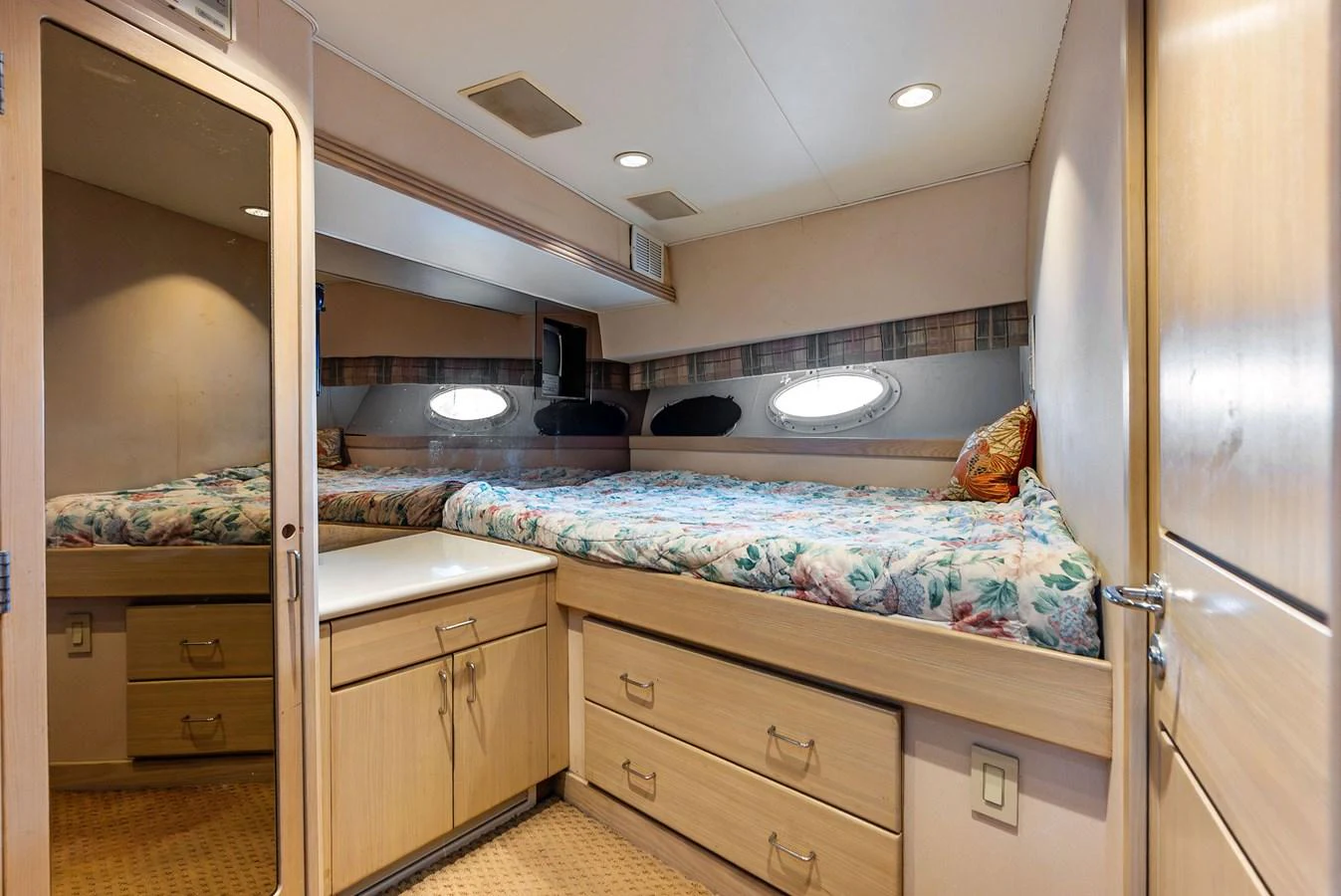 A cozy stateroom with a comfortable bed and ample storage space. aboard BRAVO ZULU Yacht for Sale