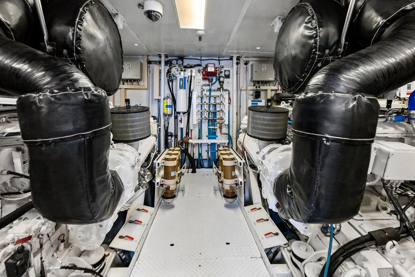 The image showcases the meticulously organized engine room of the yacht, highlighting its advanced machinery and clean layout. aboard BRAVO ZULU Yacht for Sale