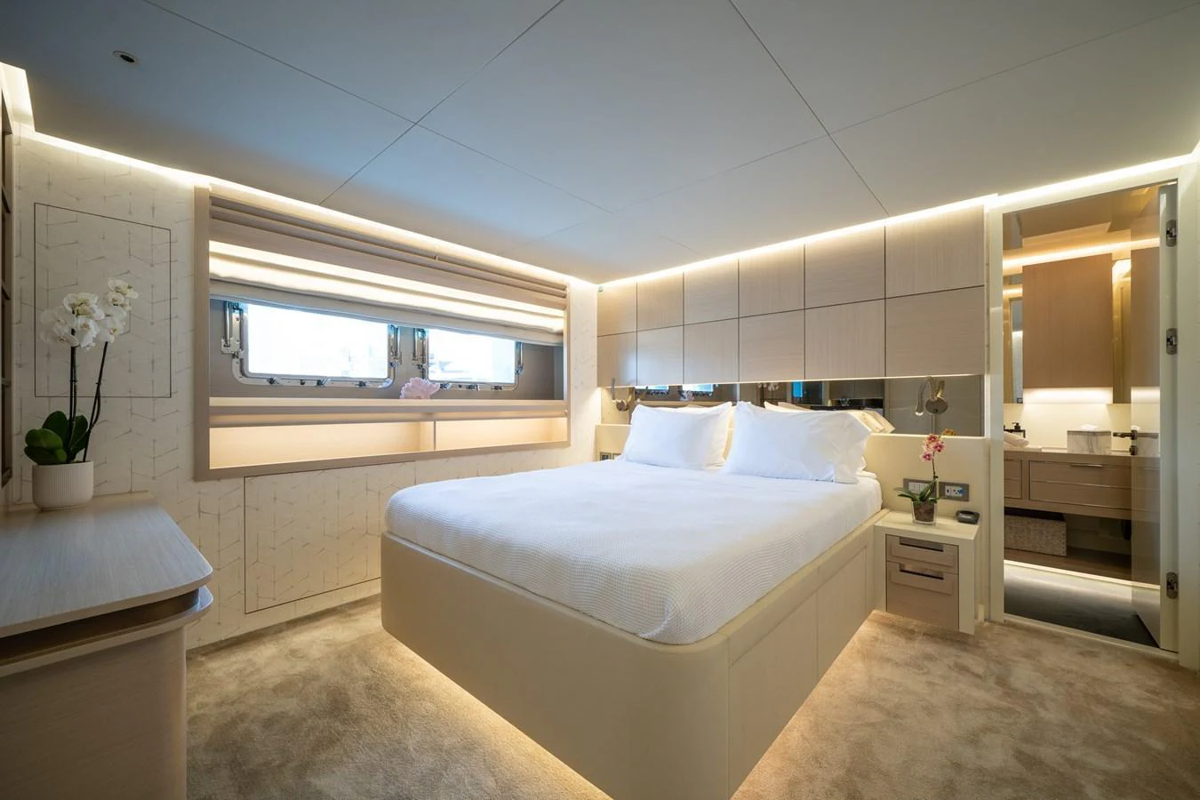 The master stateroom exudes luxury with its spacious layout, modern design, and elegant lighting. aboard M/Y MASHA Yacht for Sale