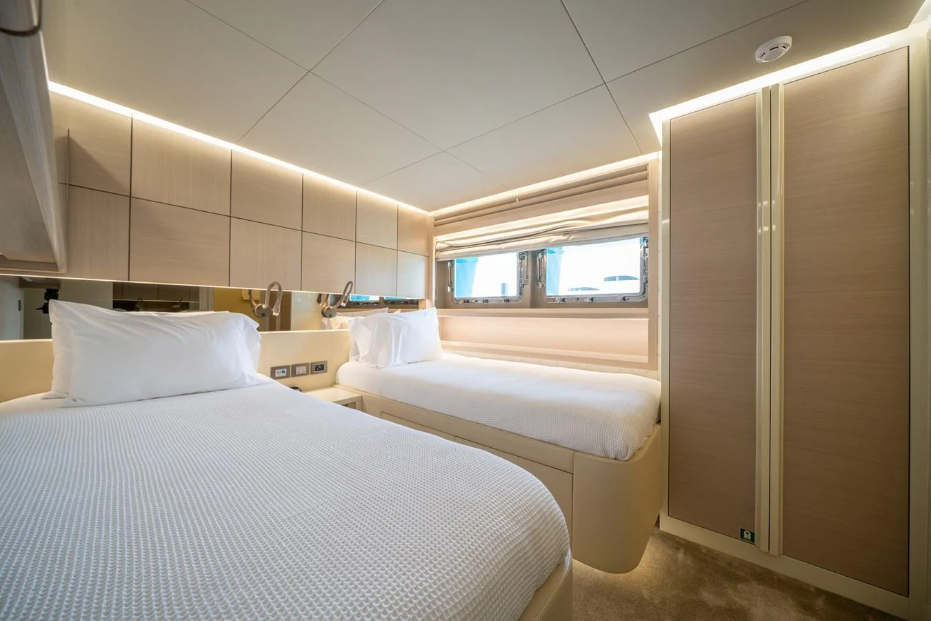The guest stateroom features twin beds and modern, elegant decor. aboard M/Y MASHA Yacht for Sale