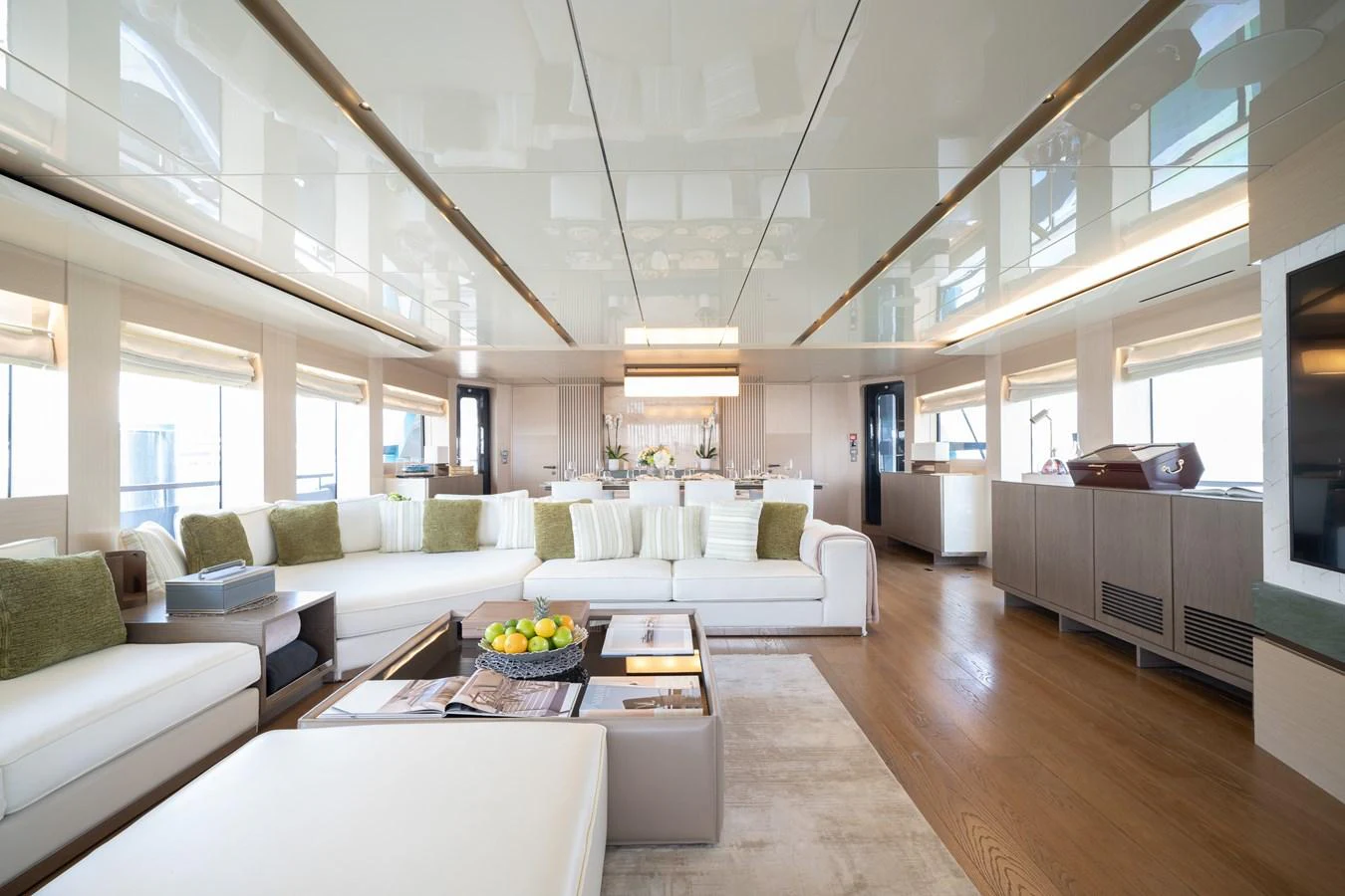 The spacious salon features elegant furnishings and ample natural light, creating a luxurious and inviting atmosphere. aboard M/Y MASHA Yacht for Sale