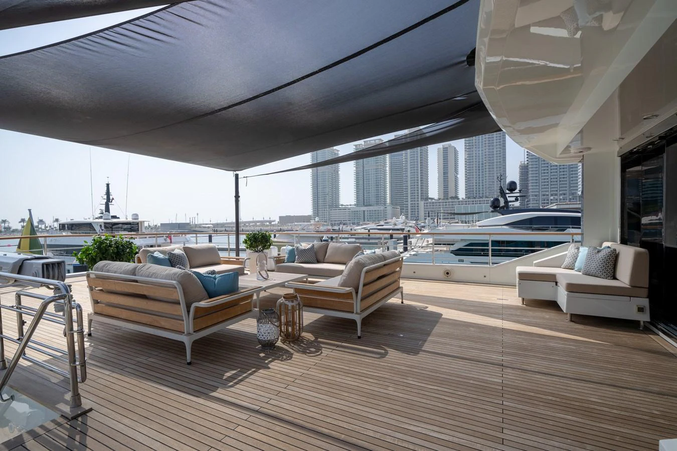 The aft deck features comfortable seating with a shaded area, perfect for relaxation and socializing. aboard M/Y MASHA Yacht for Sale