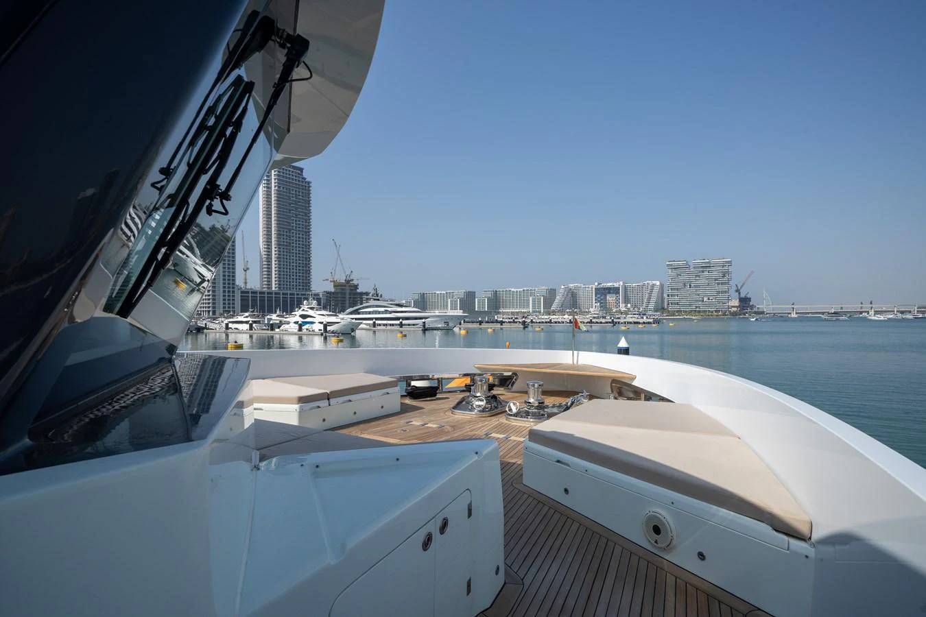 The bow of the yacht offers a spacious deck area with comfortable seating and a stunning view of the marina. aboard M/Y MASHA Yacht for Sale