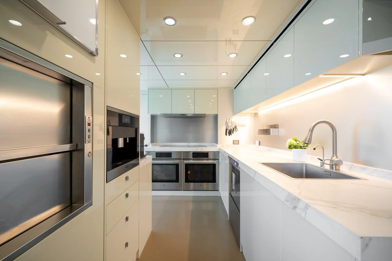 The yacht's galley features modern appliances and sleek design, perfect for gourmet cooking at sea. aboard M/Y MASHA Yacht for Sale