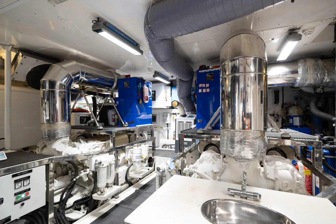 The engine room showcases advanced machinery and a clean, well-organized layout. aboard M/Y MASHA Yacht for Sale