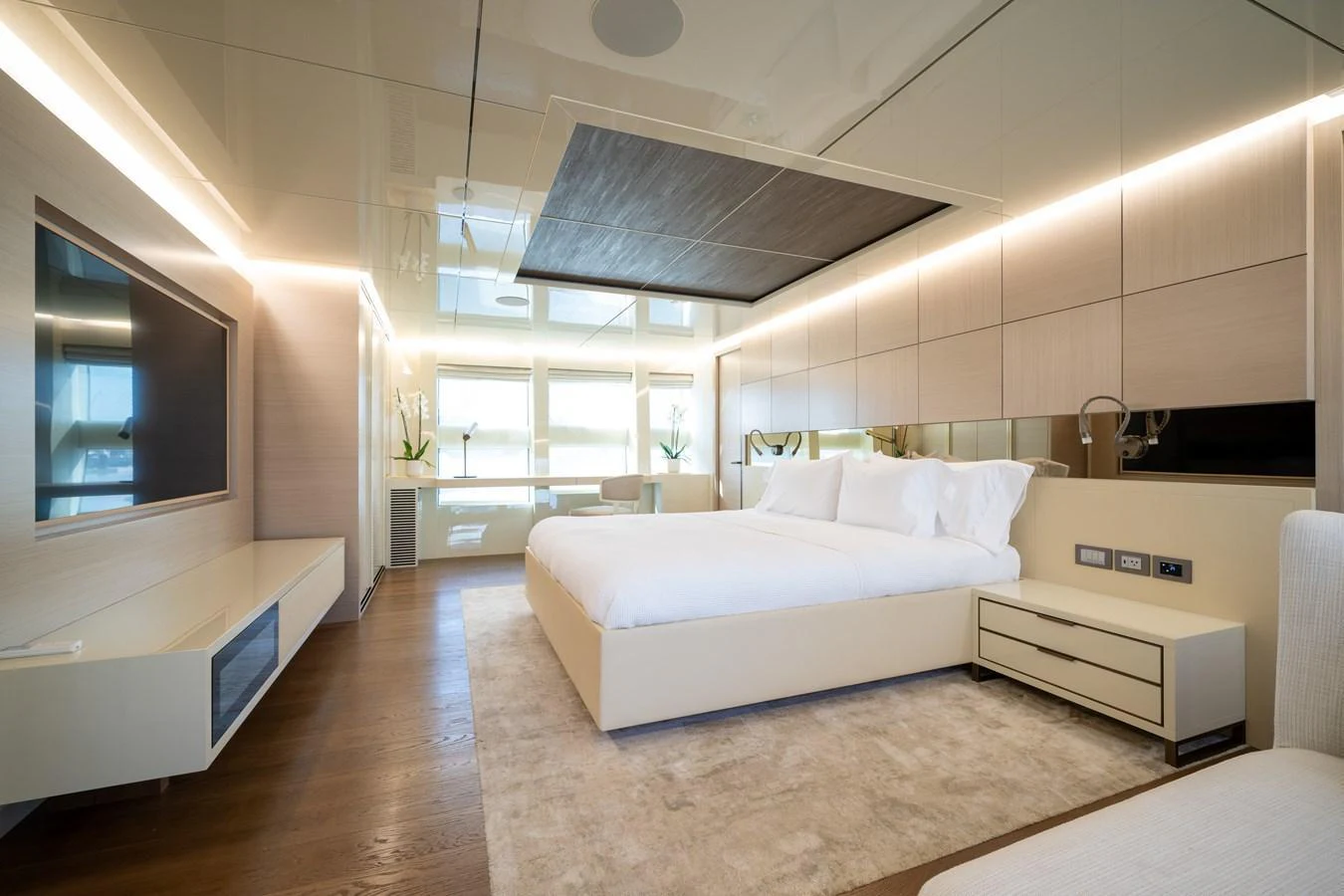 The master stateroom features a luxurious bed, modern furnishings, and ample natural light. aboard M/Y MASHA Yacht for Sale