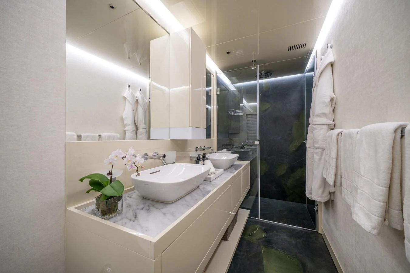 A modern and luxurious yacht bathroom with sleek fixtures and elegant design. aboard M/Y MASHA Yacht for Sale