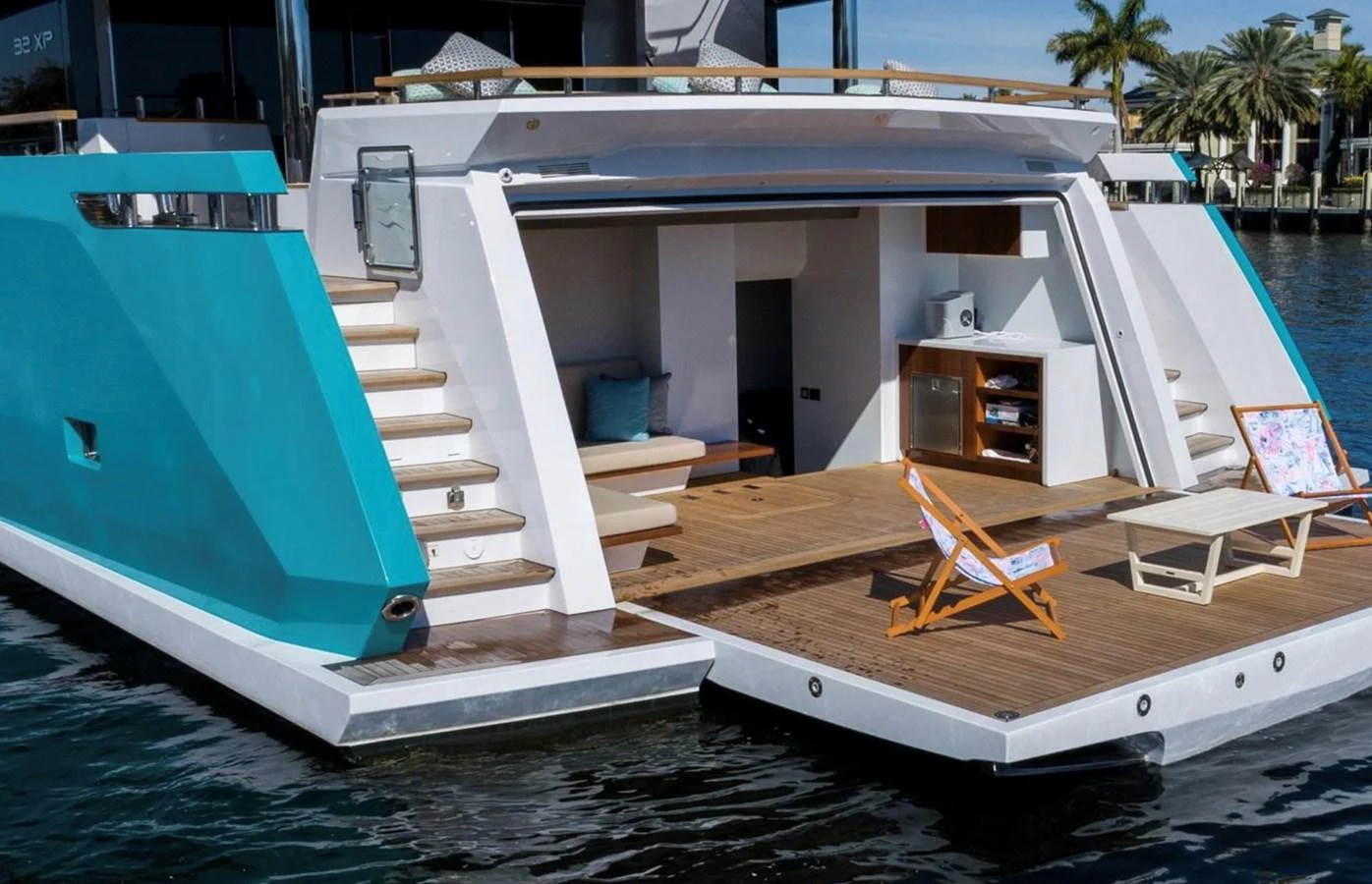 The yacht's aft deck features a spacious lounging area with direct access to the water. aboard M/Y MASHA Yacht for Sale