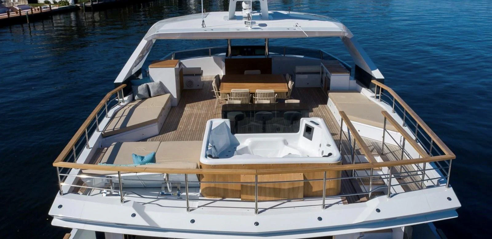 The yacht's sundeck features a luxurious hot tub, ample seating, and a dining area, perfect for relaxation and entertainment. aboard M/Y MASHA Yacht for Sale