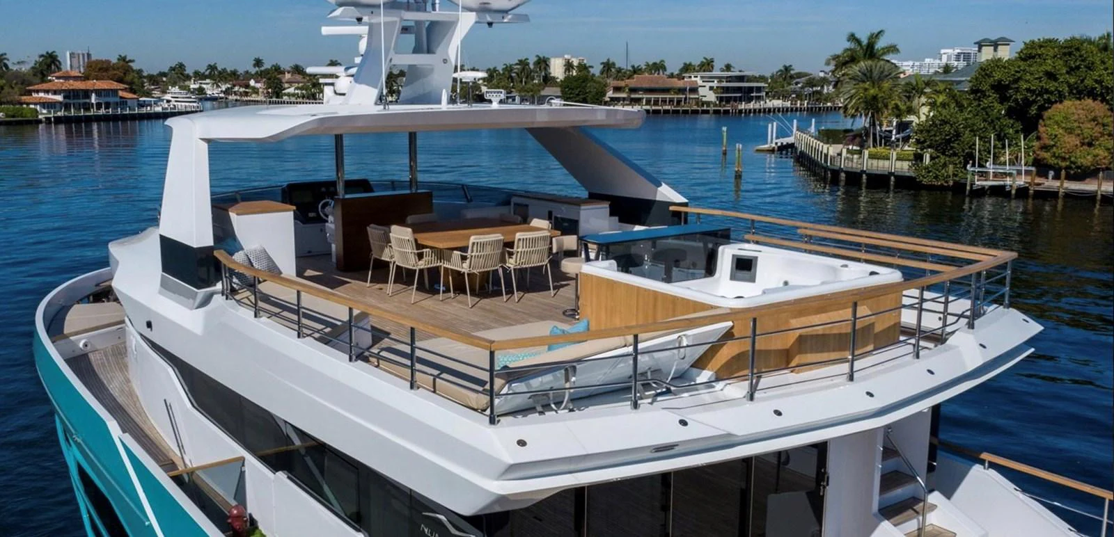 The yacht features a spacious aft deck with a dining area and a jacuzzi, perfect for outdoor relaxation and entertainment. aboard M/Y MASHA Yacht for Sale