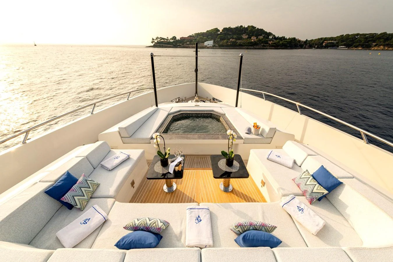 The foredeck features a luxurious jacuzzi surrounded by comfortable seating with stunning ocean views. aboard GEMS II Yacht for Sale