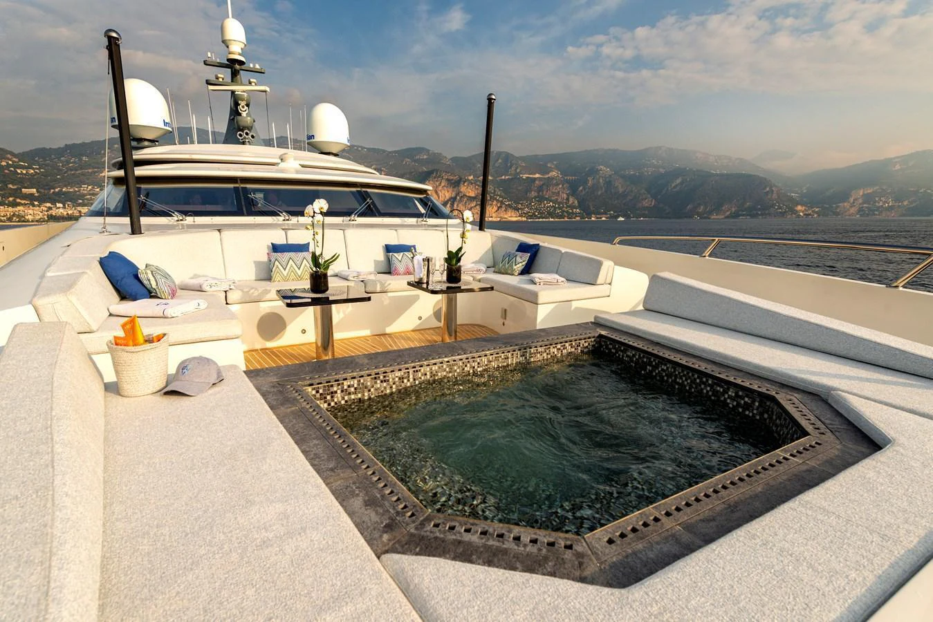 The foredeck features a luxurious hot tub surrounded by comfortable seating with scenic views. aboard GEMS II Yacht for Sale