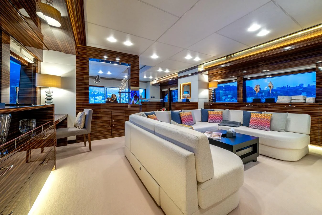 The yacht's salon features a spacious and luxurious seating area with modern decor and ample natural light. aboard GEMS II Yacht for Sale