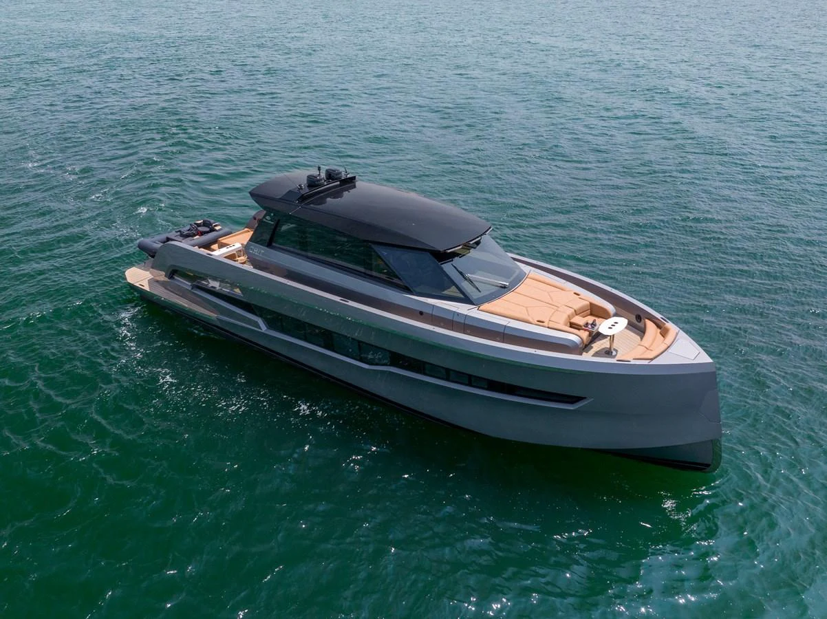 A sleek and modern yacht cruising on calm waters, showcasing its stylish design and spacious deck areas. aboard GRIT Yacht for Sale