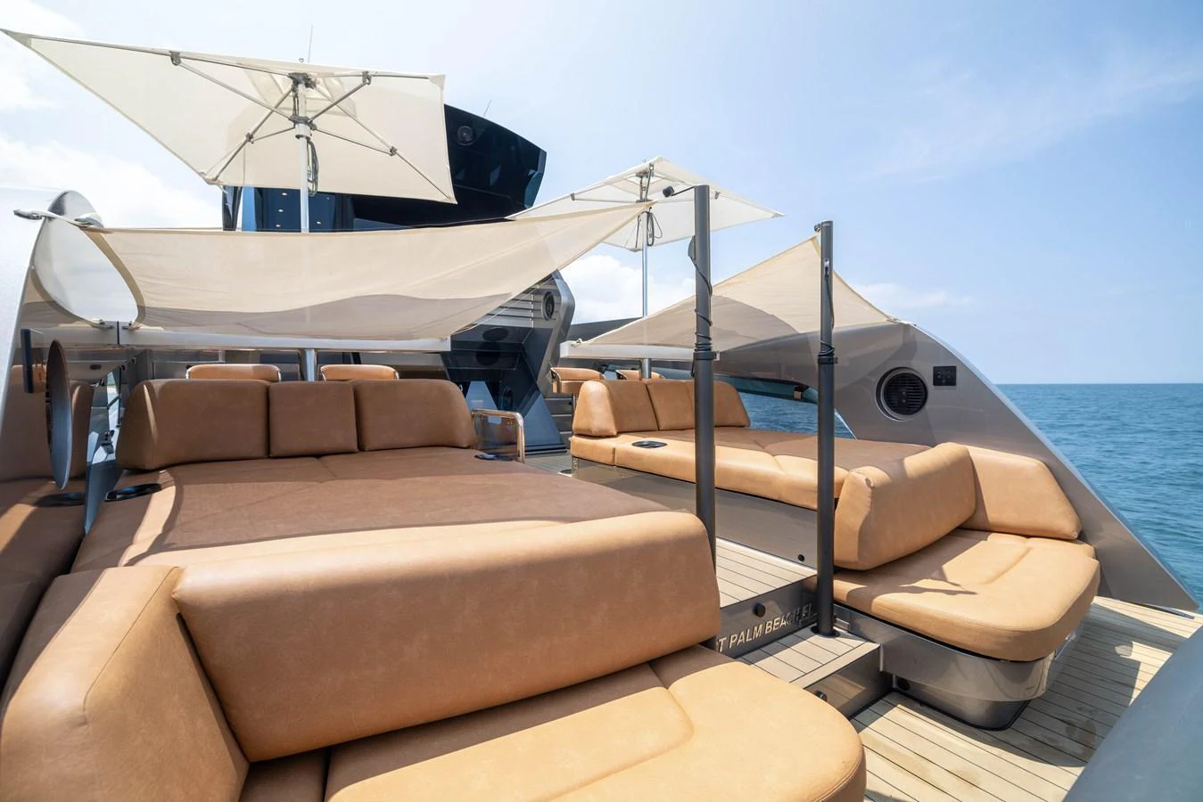 The sundeck features luxurious sun loungers and shade canopies, perfect for relaxation. aboard GRIT Yacht for Sale
